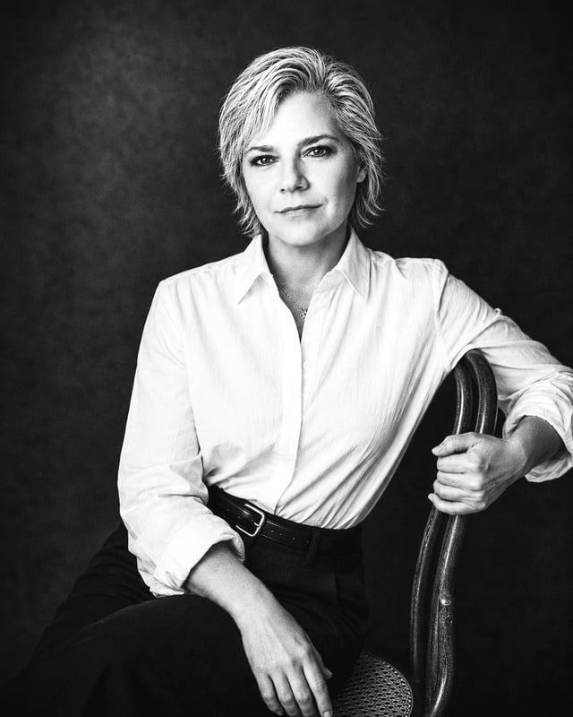 Amy Booker in a white shirt, black and white portrait
